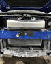 LMP Cadillac CT5-V Blackwing expansion tank showing black plastic construction with mounting fittings and fluid connections.