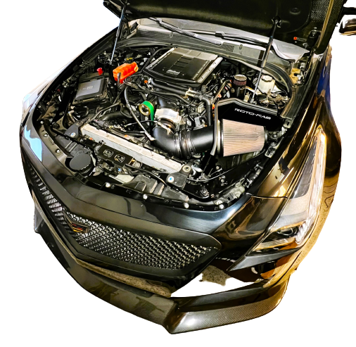 LMP Cadillac CTS-V 3 expansion tank with white plastic body and metal mounting bracket, designed for engine cooling system.