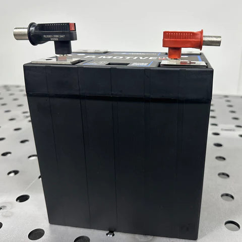 Maven Radlok battery connector with multiple metal terminals attached to a black plastic housing, used for secure electrical connections.