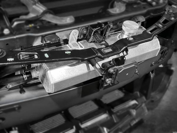 LMP Cadillac CT4-V Blackwing expansion tank shown in black, with metal fittings and mounting points, designed for engine cooling.