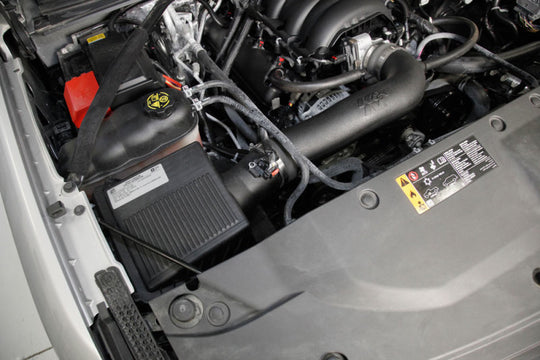 K&N Chevrolet Silverado 5.3L V8 cold air intake kit installed in engine bay, showcasing the K&N performance intake components.