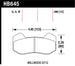 Hawk Wilwood Type 6712 DTC-60 racing brake pads showing the black brake pad with Hawk Performance branding.