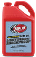 Red Line lightweight shockproof gear oil gallon container, ideal for lubricating transmissions and gearboxes in vehicles.