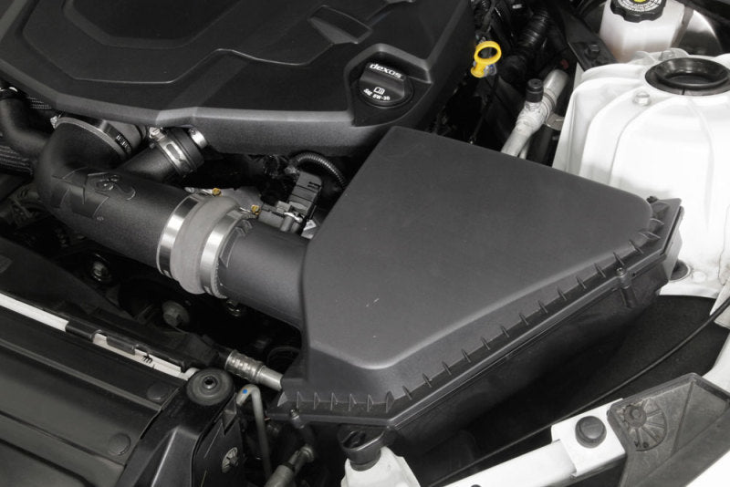 K&N Engineering cold air intake kit installed in a 2016-2019 Chevrolet Camaro V6 3.6L engine for improved performance and airflow.