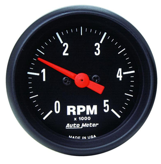 AutoMeter Z-Series 52mm oil temperature gauge showing temperature range from 100 to 250°F with a black dial and clear markings.
