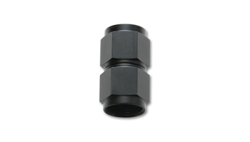 Vibrant black anodized aluminum straight coupler union adapter, -10 AN to -12 AN female fittings for automotive or racing applications.