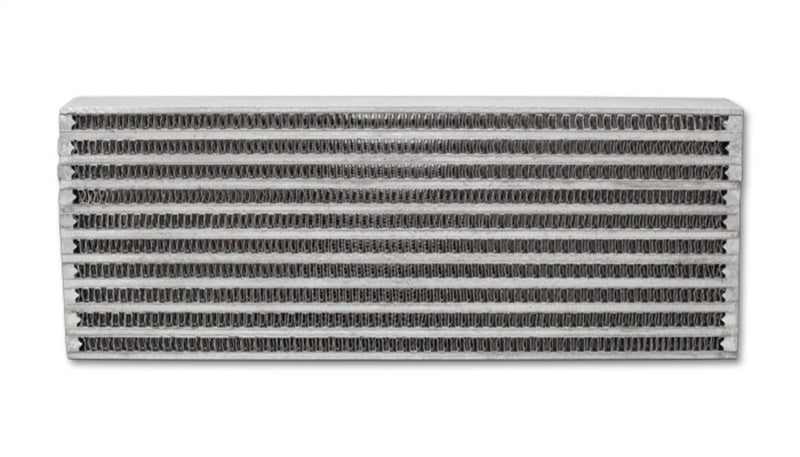Vibrant universal oil cooler core, 4x12x2 inches, showcasing metal fins and inlet/outlet ports for engine cooling.