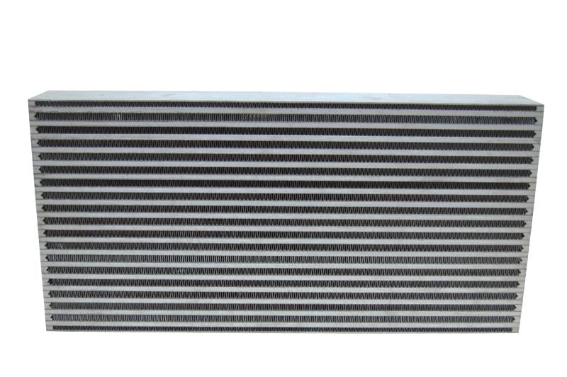 Vibrant universal oil cooler core, 4x10x1.25 inches, with metal fins and inlet/outlet ports, designed for automotive oil cooling systems.