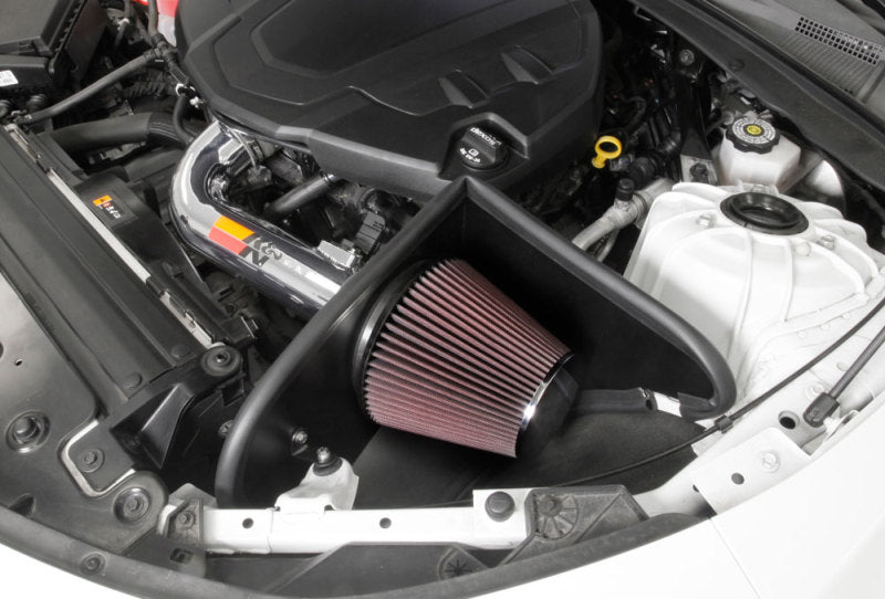 K&N Engineering silver Typhoon short ram cold air intake installed in a 2016-2017 Chevy Camaro 3.6L engine bay.