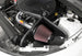 K&N Engineering silver Typhoon short ram cold air intake installed in a 2016-2017 Chevy Camaro 3.6L engine bay.