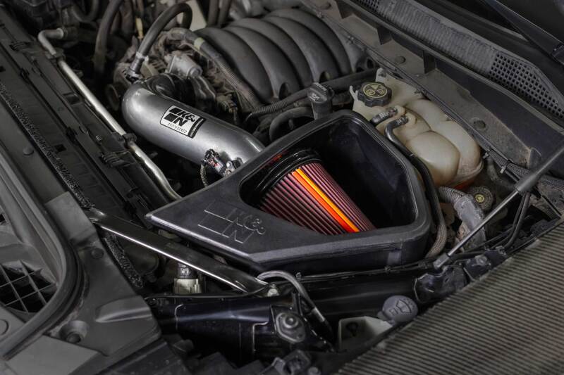 K&N Chevy/GMC 1500 V8 6.2L NextGen aluminum cold air intake system installed in engine bay, with branded filter and intake tubing