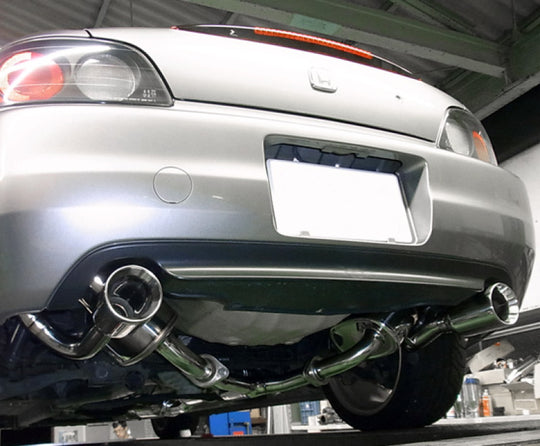 HKS Super Sound Master AP1 F20C catback exhaust system installed on a vehicle, showcasing the polished muffler and piping.