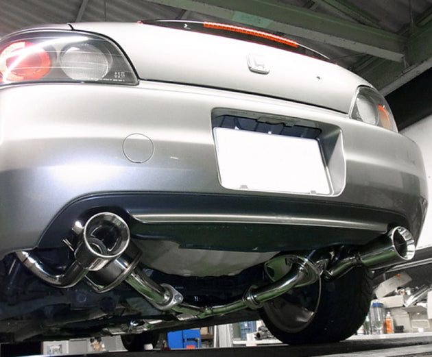 HKS Super Sound Master AP1 F20C catback exhaust system installed on a vehicle, showcasing the polished muffler and piping.