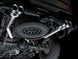 AWE Tuning 4th Gen GM 1500 6.2L catback exhaust with quad chrome tips and split rear exit, featuring bumper cutouts.