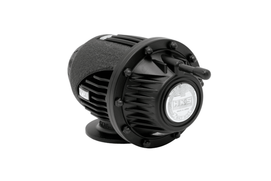 HKS Super SQV4 Black Edition blow off valve for FL5, showing the sleek black finish and compact design on a car engine.