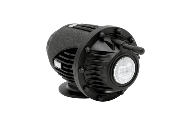 HKS Super SQV4 Black Edition blow off valve for FL5, showing the sleek black finish and compact design on a car engine.