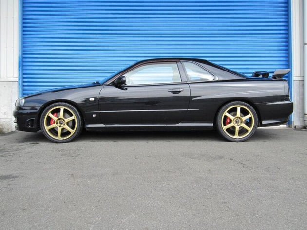 HKS Hipermax S ER34 coilover kit installed on a Nissan Skyline ER34, showing adjustable suspension components and performance-focused design.