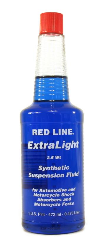 Red Line ExtraLight 2.5WT suspension fluid in a 16oz bottle, hydraulic oil for vehicle suspension systems, with red and white label.