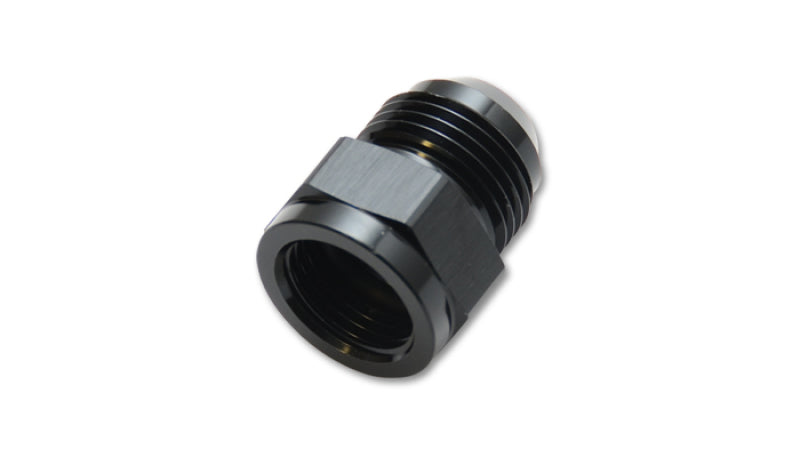 Vibrant -3AN Female to -4AN Male expander adapter fitting for automotive or hydraulic applications, showing metal fittings against a dark background.