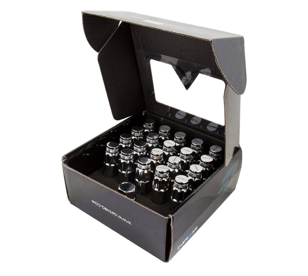 NRG 700 Series M12 x 1.5 steel lug nut set with dust cap cover, locks, and lock socket in silver, displayed on a white background.
