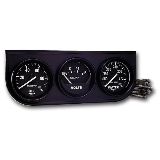 AutoMeter AutoGage 3-gauge console with oil pressure, voltage, and water temperature gauges in black with white dials and silver bezels.