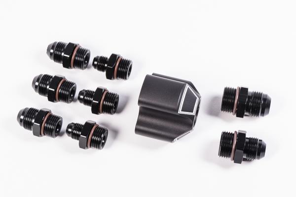 Radium Engineering 3 into 1 distribution block with fittings, metallic connectors, and compact design for automotive fluid management.