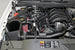 K&N 71 Series cold air intake kit installed in a Chevrolet Silverado or GMC Sierra 2014-2015, showcasing the performance air filter and intake tube.