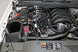K&N 71 Series cold air intake kit installed in a Chevrolet Silverado or GMC Sierra 2014-2015, showcasing the performance air filter and intake tube.