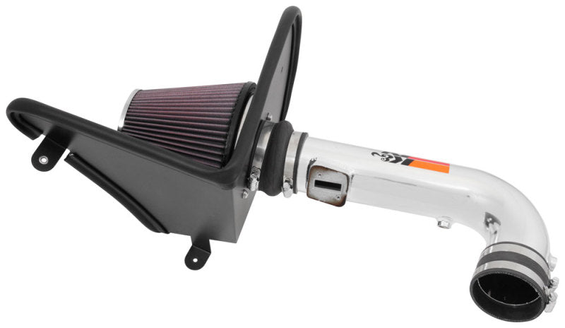 K&N Engineering silver Typhoon short ram cold air intake installed in a 2016-2017 Chevy Camaro 3.6L engine for improved airflow.