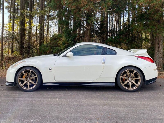 HKS HIPERMAX S Z33 coilovers installed on a Nissan 350Z, showcasing the adjustable suspension components and performance features.