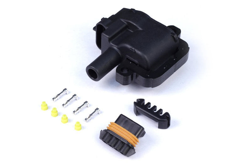 Haltech LS1 coil with built-in ignitor, plug, and pins for ignition system upgrade, designed for high-performance engine applications.