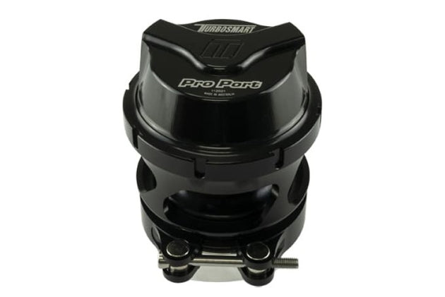Turbosmart GenV ProPort Universal 54mm Blow Off Valve installed on a turbocharged engine, showcasing its sleek design and brand logo.