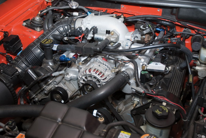 Edelbrock low profile intake elbow with 90mm throttle body to square-bore flange, cast finish for automotive performance.