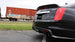 Black CORSA Performance axle-back exhaust for Cadillac CTS V 2016-2019 with 6.2L V8 engine, featuring dual tips and aggressive design.