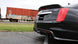Black CORSA Performance axle-back exhaust for Cadillac CTS V 2016-2019 with 6.2L V8 engine, featuring dual tips and aggressive design.