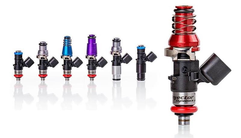 Injector Dynamics ID1050X fuel injector set for 8-cylinder engines, includes grey 14mm adaptor top and orange lower O-ring.