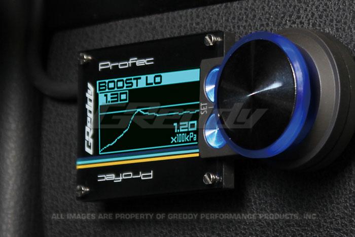GReddy PRofec electronic boost controller with digital display and control buttons for precise turbo boost management.