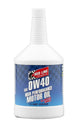 Red Line 0W40 motor oil quart bottle with red and black label, featuring the Red Line logo and product details on the container.