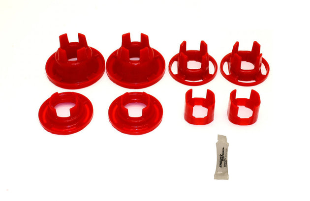 Red BMR Suspension BMR 10-11 5th Gen Camaro rear cradle poly inserts differential bushing kit, close-up view of bushings installed.