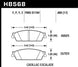 Hawk Performance OE rear brake pads for Chevy Tahoe LTZ LTS, showing the brake pad set with metal backing plates and friction material.