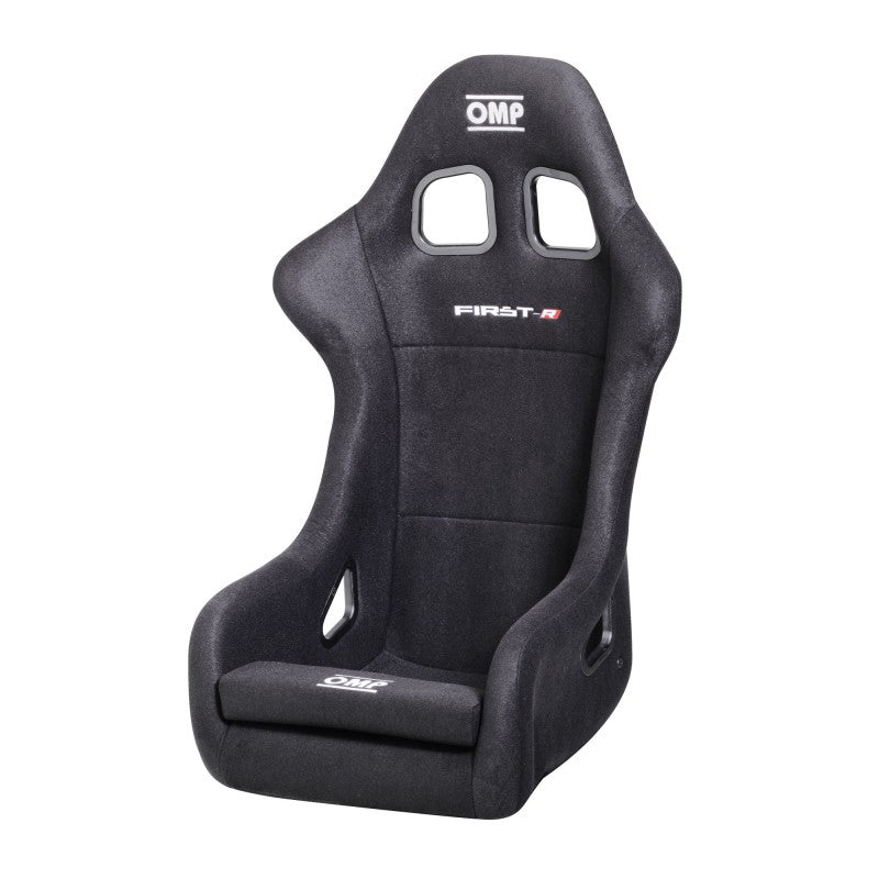 Black OMP First Series racing seat with ergonomic design and supportive padding, ideal for motorsport enthusiasts.