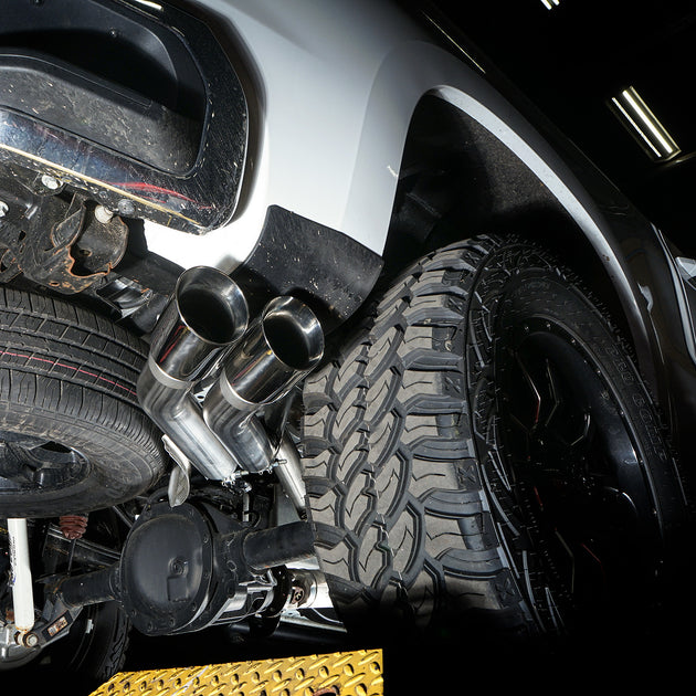 Stainless Works Catback Exhaust installed on a 2019-2026 Silverado pickup truck, showcasing the polished exhaust system and dual tips.