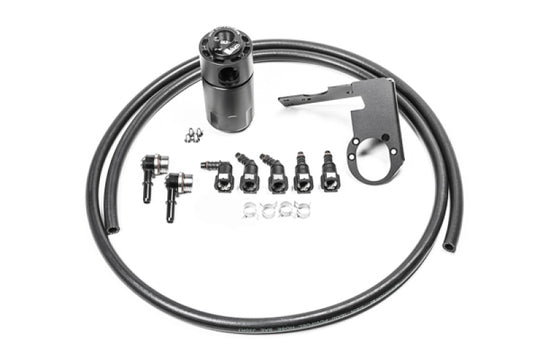 Radium Engineering Chevrolet Corvette oil catch can kit with fluid lock CCV catch can installed in engine bay.
