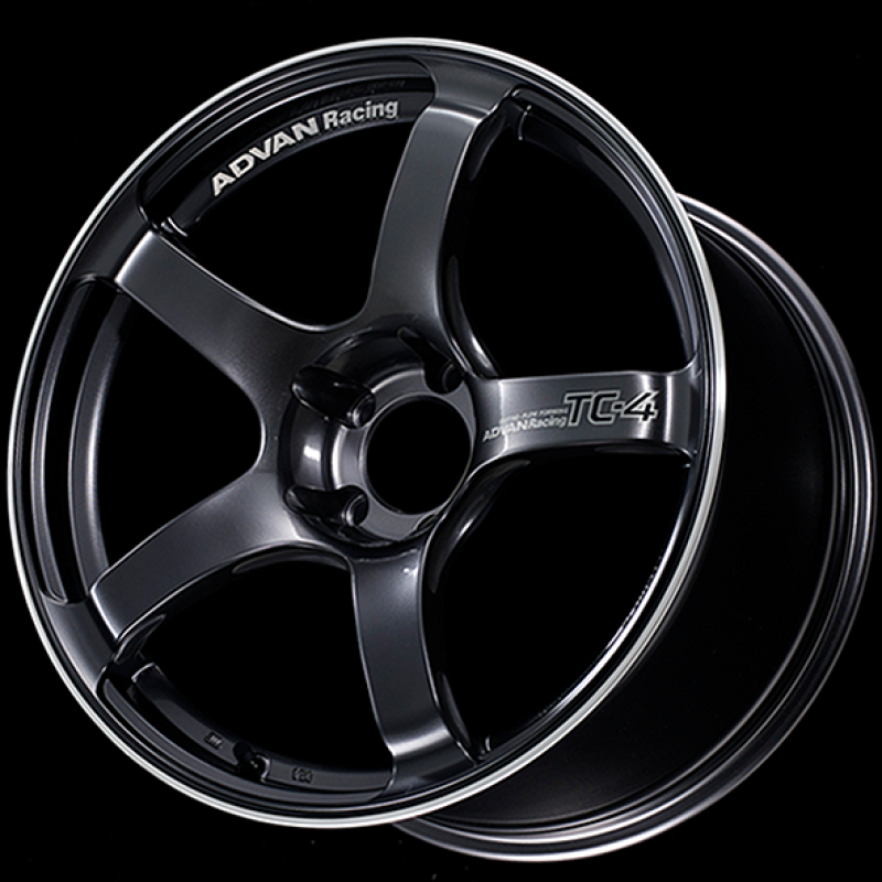 Advan TC4 18x9.5 +12 racing gunmetal cast wheel with 5x114.3 bolt pattern and ring design, close-up view of the wheel’s finish.