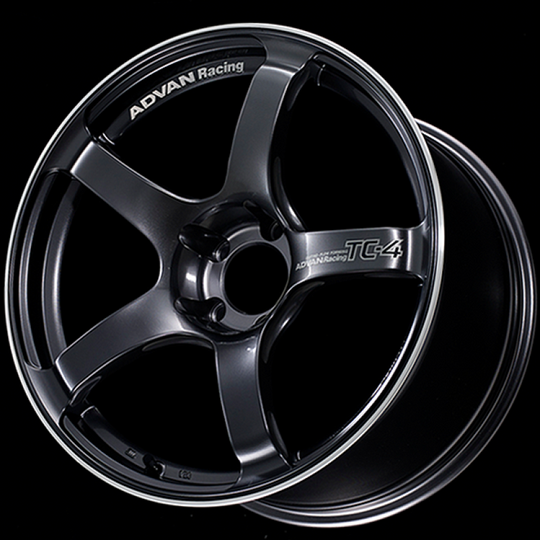 Advan TC4 18x9.5 +12 racing gunmetal cast wheel with 5x114.3 bolt pattern and ring design, close-up view of the wheel’s finish.