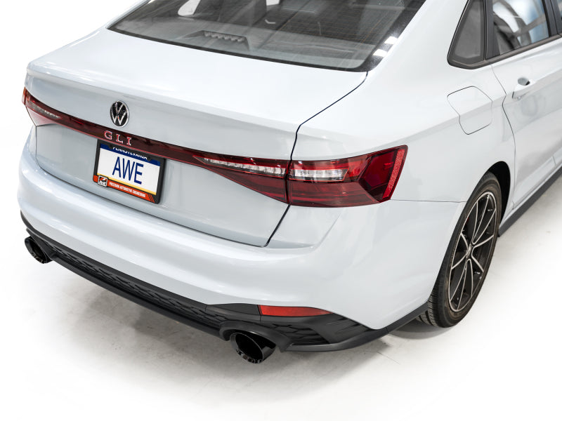 AWE Tuning 22-25 Volkswagen Jetta GLI Touring Edition catback exhaust with diamond black tips, showcasing sleek chrome finish and piping.