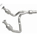 MagnaFlow direct fit catalytic converter for 2015 GMC Yukon XL V8 6.2L engine, showing the metallic converter with inlet and outlet pipes.