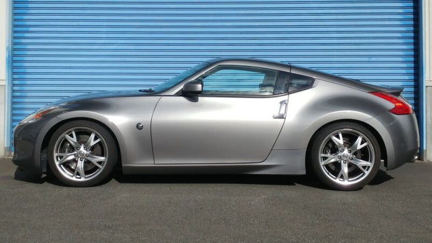 HKS HIPERMAX S Z34 coilovers installed on a Nissan 370Z, showcasing adjustable suspension components and sleek design.