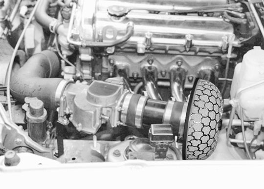 HKS SPF NA6CE B6-ZE high-performance direct fit air filter installed in a vehicle engine bay