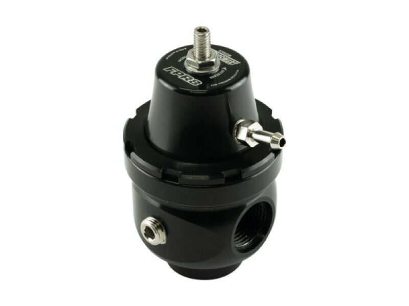 Turbosmart FPR8 fuel pressure regulator installed in a vehicle engine, showcasing its compact design and connection fittings.
